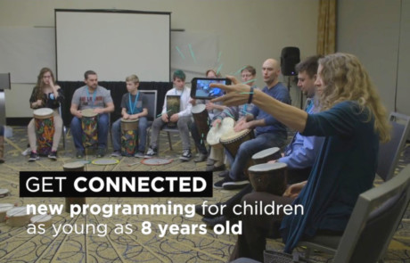 social media video thumbnail of youths teens adults drumming from medical conference filming