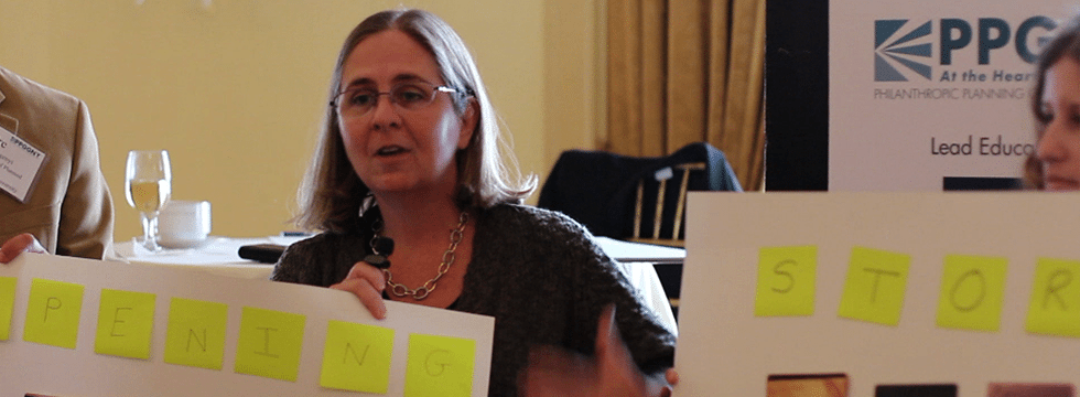 Image of a presenter showing a storyboard