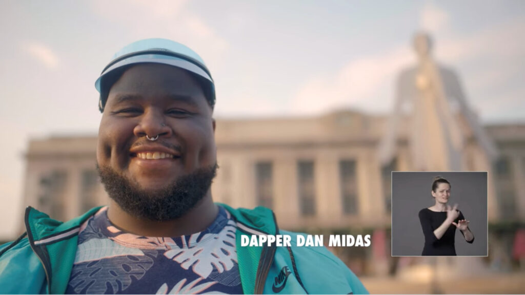 thumbnail of ASL commercial with picture in picture for Baltimore covid-19 vaccination video with Dapper Dan Midas American Sign Language