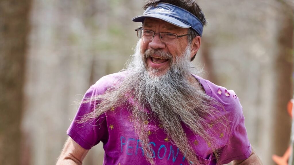 Older man with long beard smiling in anniversary storytelling video thumbnail